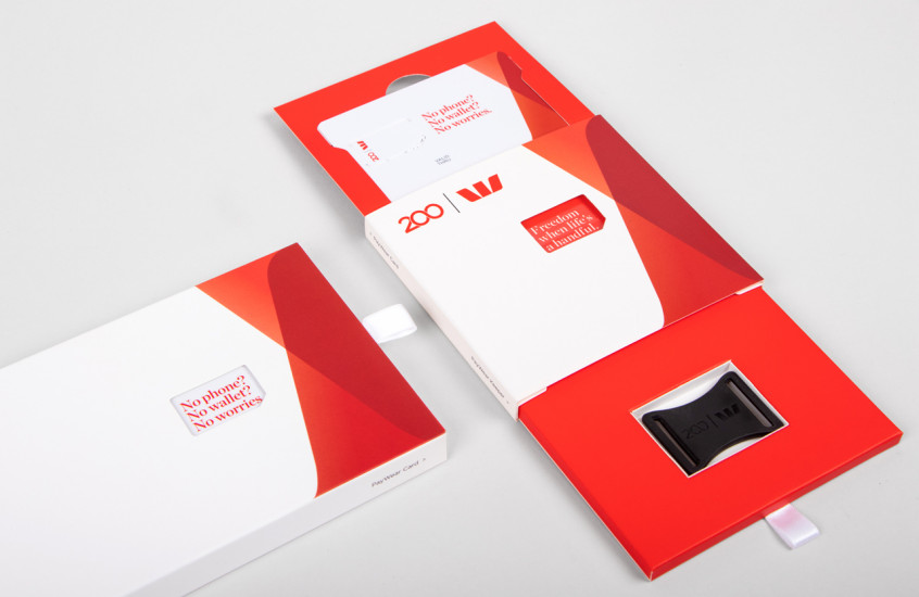 Westpac - PayWear — Packaging that presents both a card and a wearable in a unique way. The diecut window in the cover brings an animated and clever element to the design.